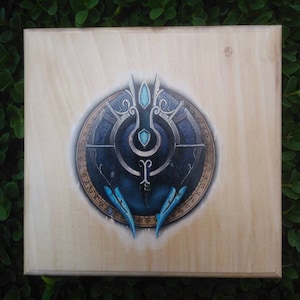 Silver Covenant symbol from World of Warcraft transferred to wood