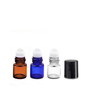 May include: Three glass roller bottles with white roller balls. The bottles are amber, blue, and clear. A black plastic roller bottle cap is also shown.
