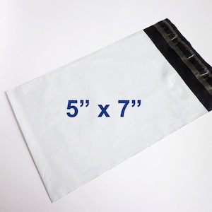 May include: White plastic mailing envelope with a black adhesive strip. The envelope measures 5 inches by 7 inches.