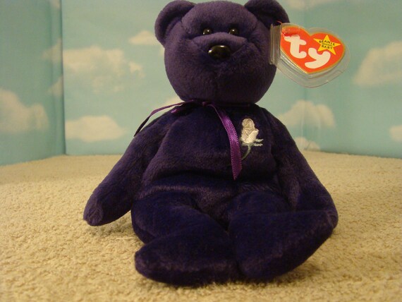purple ty bear with white rose