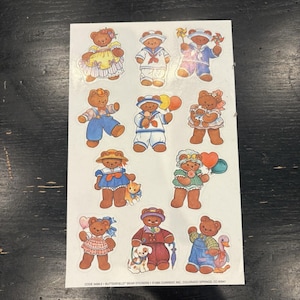 May include: A sheet of eleven die-cut stickers featuring brown teddy bears in various outfits and activities, including holding balloons, pinwheels, and pets. The bottom text reads: CODE 3499-2 BUTTERFIELD BEAR STICKERS © 1985 CURRENT, INC., COLORADO SPRINGS, CO 80941.
