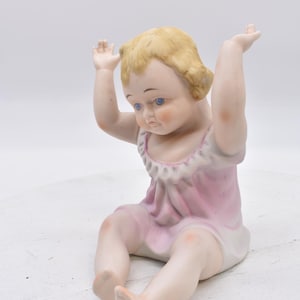 Vintage bisque porcelain piano baby Girl 7&quot; Arms up, unmarked