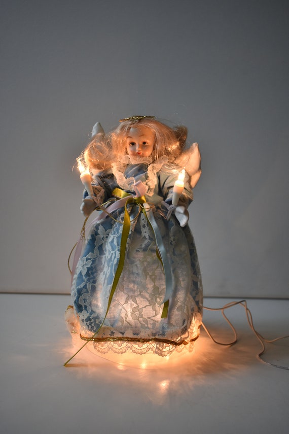 Lighted angel tree topper discount