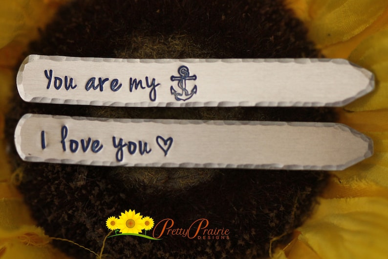 May include: Two silver metal tags with a hammered finish. The top tag says "You are my" with a blue anchor symbol. The bottom tag says "I love you" with a heart symbol.