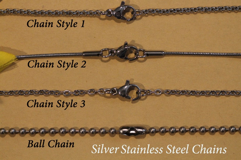 May include: Four different styles of silver stainless steel chains, including a ball chain, a chain style 1, a chain style 2, and a chain style 3.