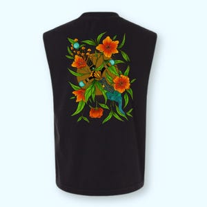 May include: A black sleeveless shirt featuring a central graphic print of a sword entwined with vibrant orange flowers, green leaves, and small mushrooms. The sword handle is detailed with blue accents and a dark, patterned blade design.