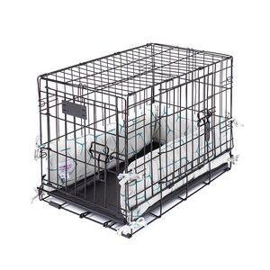May include: A black metal dog crate with a white and blue patterned bed inside. The crate has a door on the side and a handle on the top.
