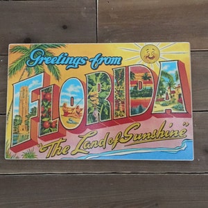 Greetings from Florida sign - photo on wood