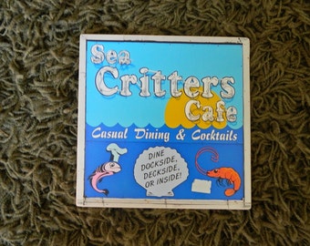 Sea Critters Cafe sign - photo on wood