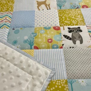 Handmade patchwork baby blanket woodland
