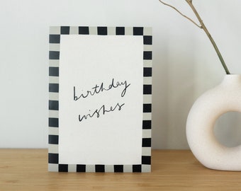 Typographic 'Birthday Wishes' card with black and white border