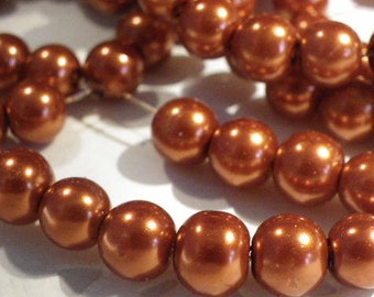 a beautiful 8 mm orange 100 mother of Pearl glass beads