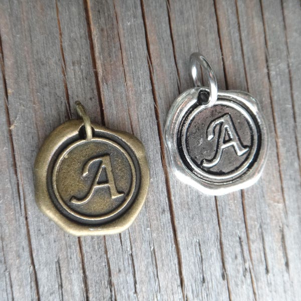 Add a letter . Initial Letter . Custom Monogram . Oxidized silver medallion wax seal . Charm letter . Customize your jewelry. Tag. Charm