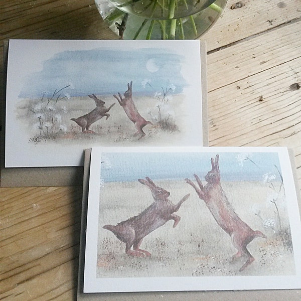 Boxing hares. Hand painted Norfolk Hares fighting. Printed on 100% recycled card. Hares at moonlight. Wildlife card. Hare card.