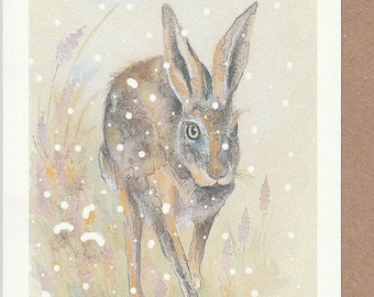 Hase Weihnachtskarte. Hase läuft im Schnee. Weihnachtskarte mit einem Hasen. Weihnachtskarten. Weihnachtskarte. Hasenkarte. Hase Aquarell