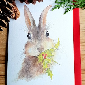 Bunny Christmas card. Christmas card with a bunny. funny bunny card. funny rabbit christmas card. bunny and holly. christmas card.
