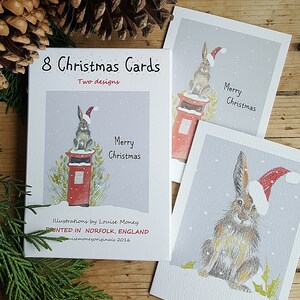 Hare Christmas cards. Two hare designs featured in a pack of eight cards and envelopes. Hare cards. Multi pack. Norfolkhares. eightharecards