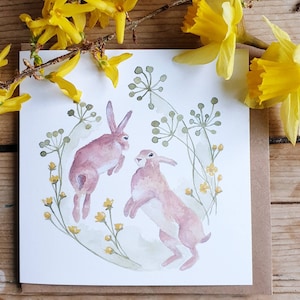 Boxen Hasen. Kampfhasen. Norfolk Hasen kämpfen. Aquarell von kämpfenden Hasen. Hase Karte. Handgemachte Osterkarte. Karte mit Boxhasen