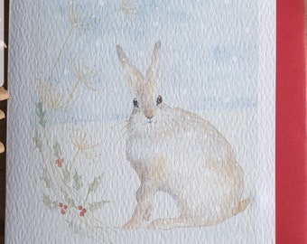 Hare Christmas card. Hare in the snow. funny christmas card. Norfolk hare. hare painting. Norfolk hare in the snow. hare card. Hare Christma