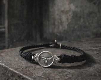 CERCA LA LUCE — Bracciale in pelle nera intrecciata e argento sterling 925, ispirato alle Lucciole di The Last of Us