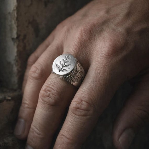 ELLIE RING - A sterling silver signet ring inspired by The Last of Us, featuring an engraved fern and sculpted night moth on the sides