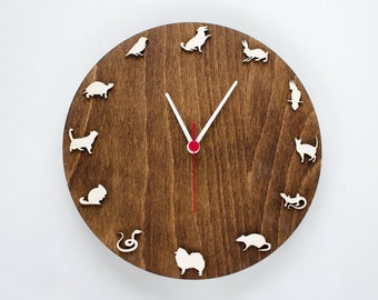 Wooden clock for vet clinic with different animals and birds