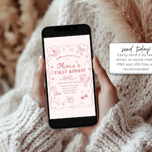 May include: A smartphone displays a pink invitation for "Olivia's First Rodeo!" with cowboy-themed illustrations. The phone is held by a person wearing a cream-colored sweater. A small white sign reads "send today!"