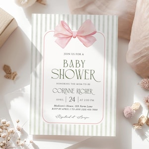 May include: Baby shower invitation with a pink bow at the top. The invitation has a striped background with text that reads "Join us for a Baby Shower" and details for the event, including the date, time, and location.