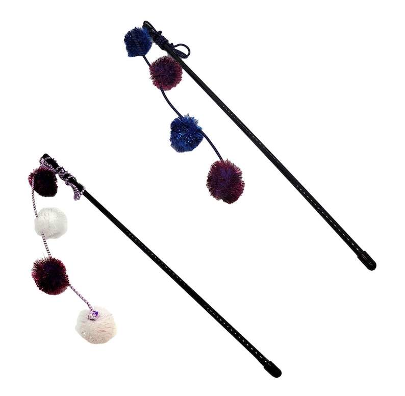 May include: Two cat toys with black poles and colorful pom-poms. One toy has white, purple, and blue pom-poms. The other toy has blue and purple pom-poms.