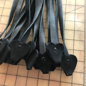 Black leather flogger