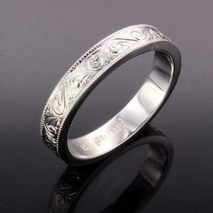 Hand engraved silver wedding band