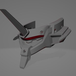 May include: A gray, angular, futuristic-looking object with red accents. It has a prominent, upward-pointing fin and several geometric shapes. The design suggests a mechanical or technological theme.