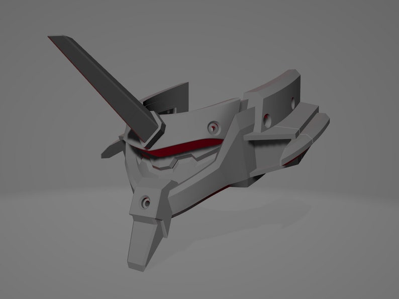 May include: A gray, angular, futuristic-looking object with red accents. It has a prominent, upward-pointing fin and several geometric shapes. The design suggests a mechanical or technological theme.