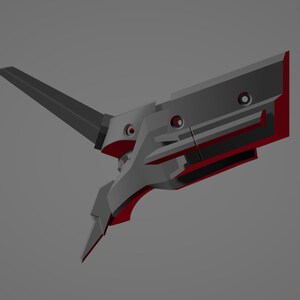 May include: A futuristic, angular weapon design in shades of gray and red. The object has a blade-like extension and several circular openings. The overall design suggests a high-tech or science fiction theme.
