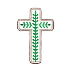May include: A white cross with a green leafy design. The cross is outlined in brown.