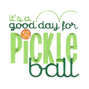 May include: Green and white embroidered design with the text "it's a good day for pickle ball" and a small orange and white pickleball.