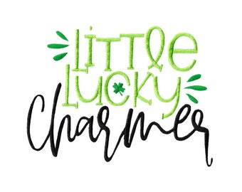May include: Green and black embroidery design with the text "little lucky charmer".