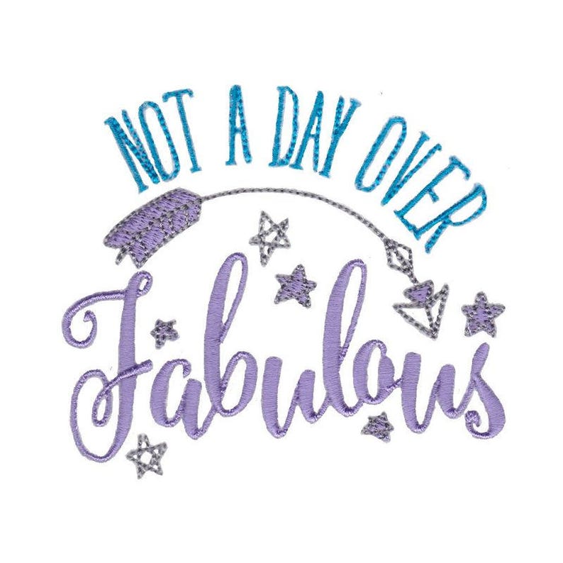 May include: Purple embroidery design with the text "Not a day over fabulous" in a blue cursive font. The design includes silver stars and diamonds.