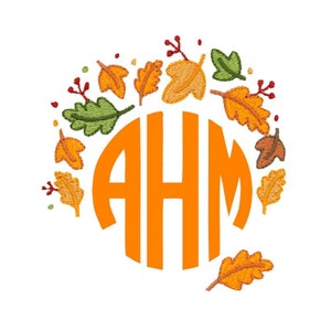 May include: Orange monogram with the letters "AHM" surrounded by a circle of fall leaves in shades of orange, yellow, green, and brown.