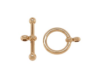 May include: A rose gold-toned toggle clasp for jewelry making, consisting of a T-bar component with a central loop and a circular ring component featuring a small side attachment loop, both with a smooth, polished metallic finish.