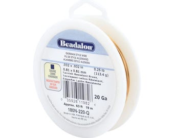 May include: A spool of 20 gauge gold-colored tarnish resistant German style wire. The spool is labeled "Beadalon" and includes the measurements 0.032 x 0.032 in, 0.81 x 0.81 mm, 0.25 lb (113.4 g), Approx. 63 ft 19 m, 180N-220-Q.