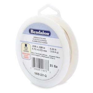 May include: A spool of 21 gauge German style non-tarnish silver wire, 0.028 inches in diameter, weighing 0.25 pounds. The spool is labeled "Beadalon" and has a barcode.