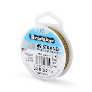 May include: A spool of Beadalon 49 strand bead stringing wire in satin gold color. The label indicates a diameter of .015 inches, a length of 30 feet, and a break strength of 13 pounds. The spool features a white plastic design with a hanging tab.