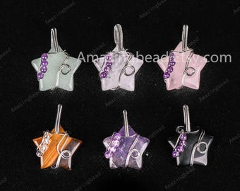 May include: Six star-shaped pendants made of various gemstones, including amethyst, rose quartz, tiger's eye, and aventurine, are wrapped in silver wire. Each pendant features a small amethyst bead on the wire.