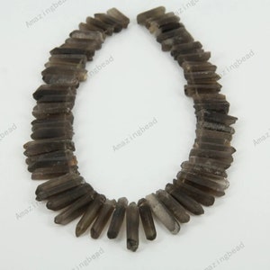 15.5 inches of strand,approx 75pcs,Natural Quartz Slightly Smoky Crystal,Tusk Shape Pointed Top Drilled Pendant