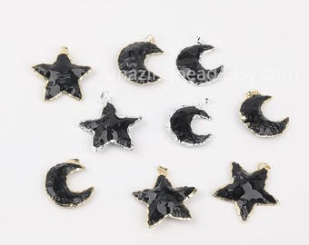 May include: A set of black and silver metal charms featuring crescent moons and stars. The charms have a textured, hammered finish and are perfect for jewelry making.