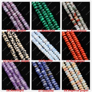 May include: A selection of gemstone beads in various colours, including lilac jasper, malachite, bloodstone, dalmatian jasper, opalite, red jasper, amethyst, sodalite, and imperial jasper. Each strand is labelled with its name.