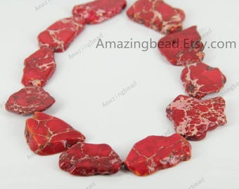 May include: A strand of red and white jasper beads, each bead is irregularly shaped and has a unique pattern. The beads are arranged in a circle on a white background. The text "Amazingbead.Etsy.com" is visible in the image.