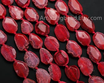 May include: Strands of faceted, oval-shaped red gemstone beads. The beads are strung on red cord, with a mix of opaque and translucent sections. The Etsy shop name "Amazingbead.Etsy.com" is visible in the image.