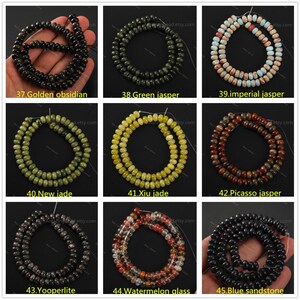 May include: A collection of beaded necklaces in various colors and materials. The image displays strands of golden obsidian, green jasper, imperial jasper, new jade, xiu jade, Picasso jasper, yooperlite, watermelon glass, and blue sandstone.